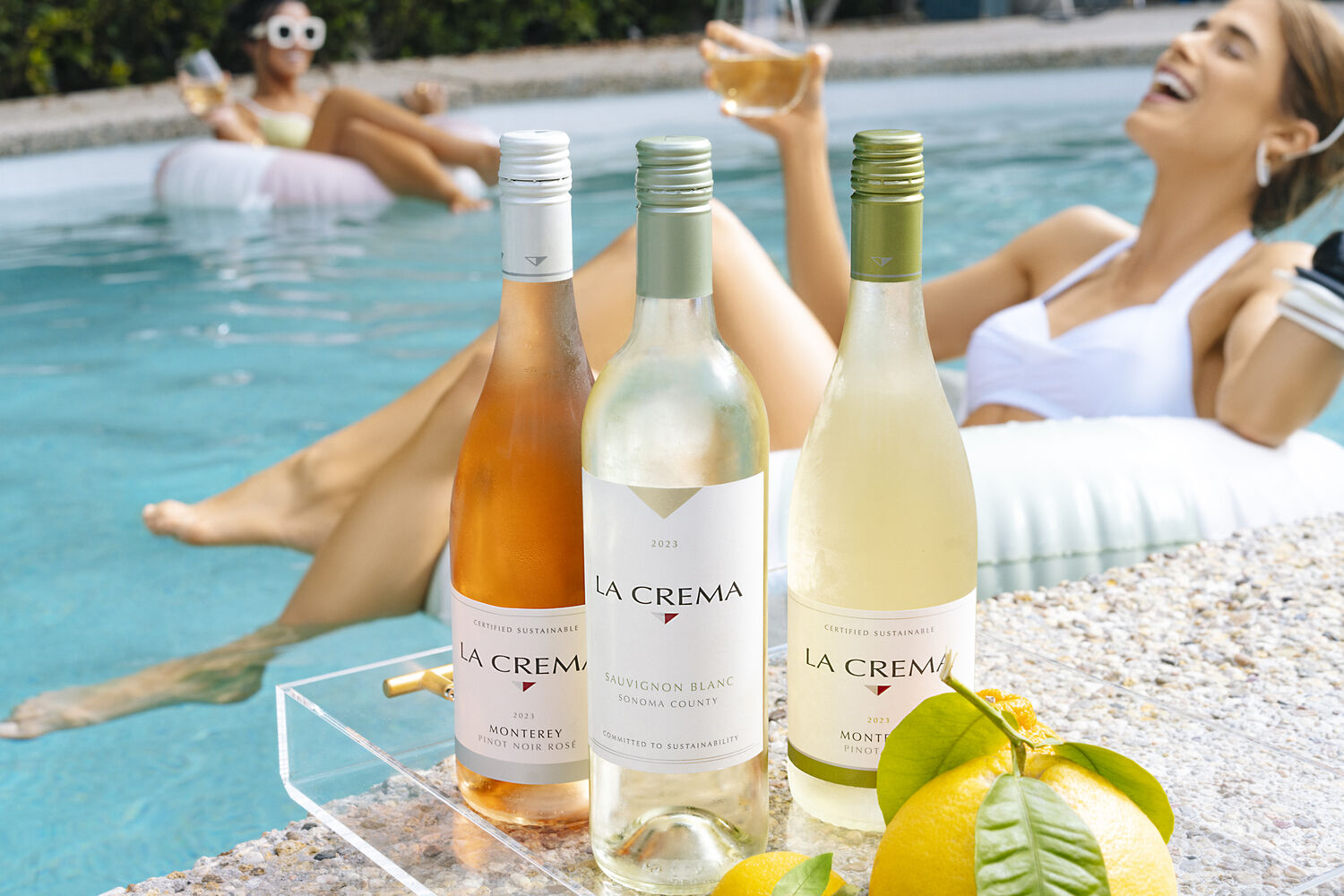Drinking wine by the pool
